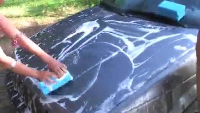 Topless college chicks erotically wash car at the picnic